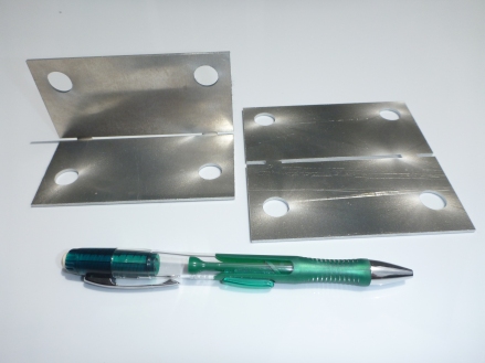 0.08 inch thick aluminum 5052 piece bent (left) and original flat piece (right)