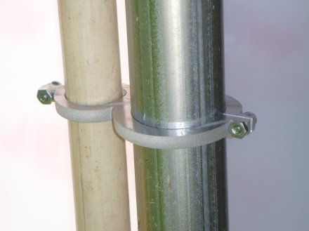  waterjet cut custom clamp holding two poles together.